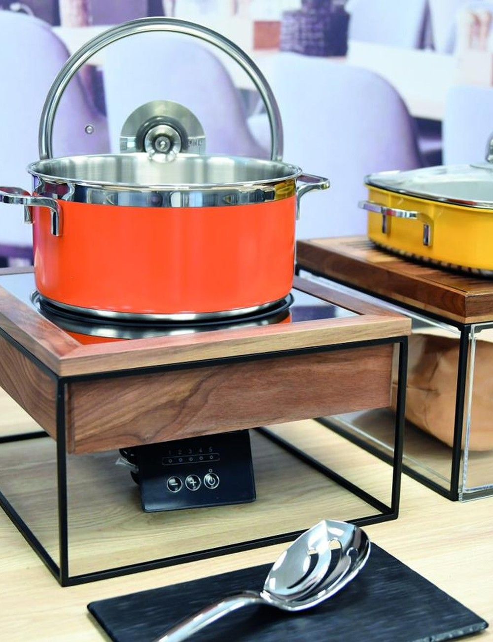 Induction station in use with a coloured stainless steel pot
