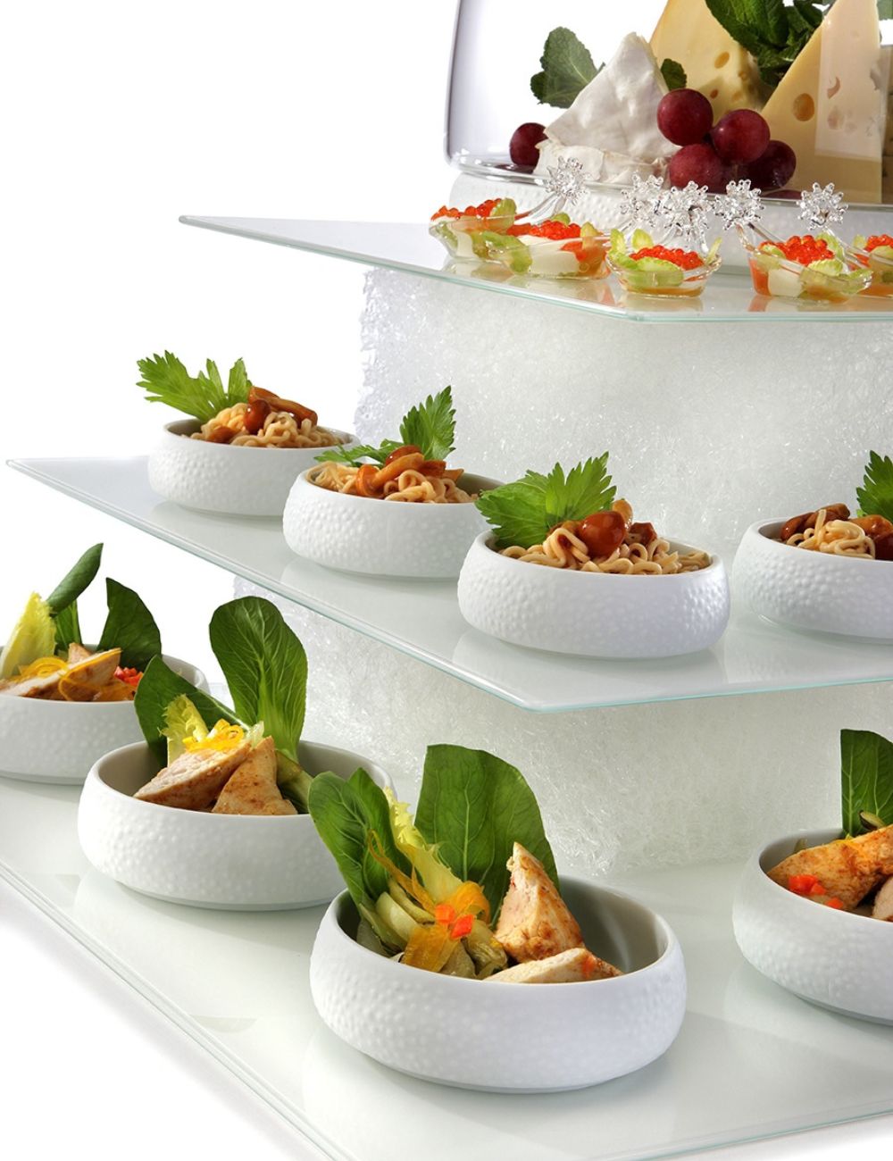 Textura blocks in use, supporting glass plates dressed with canapés