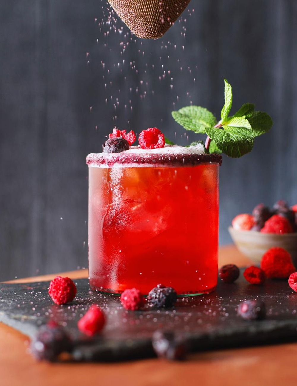 Bar scene featuring FRONA dried mixed berries as a cocktail garnish