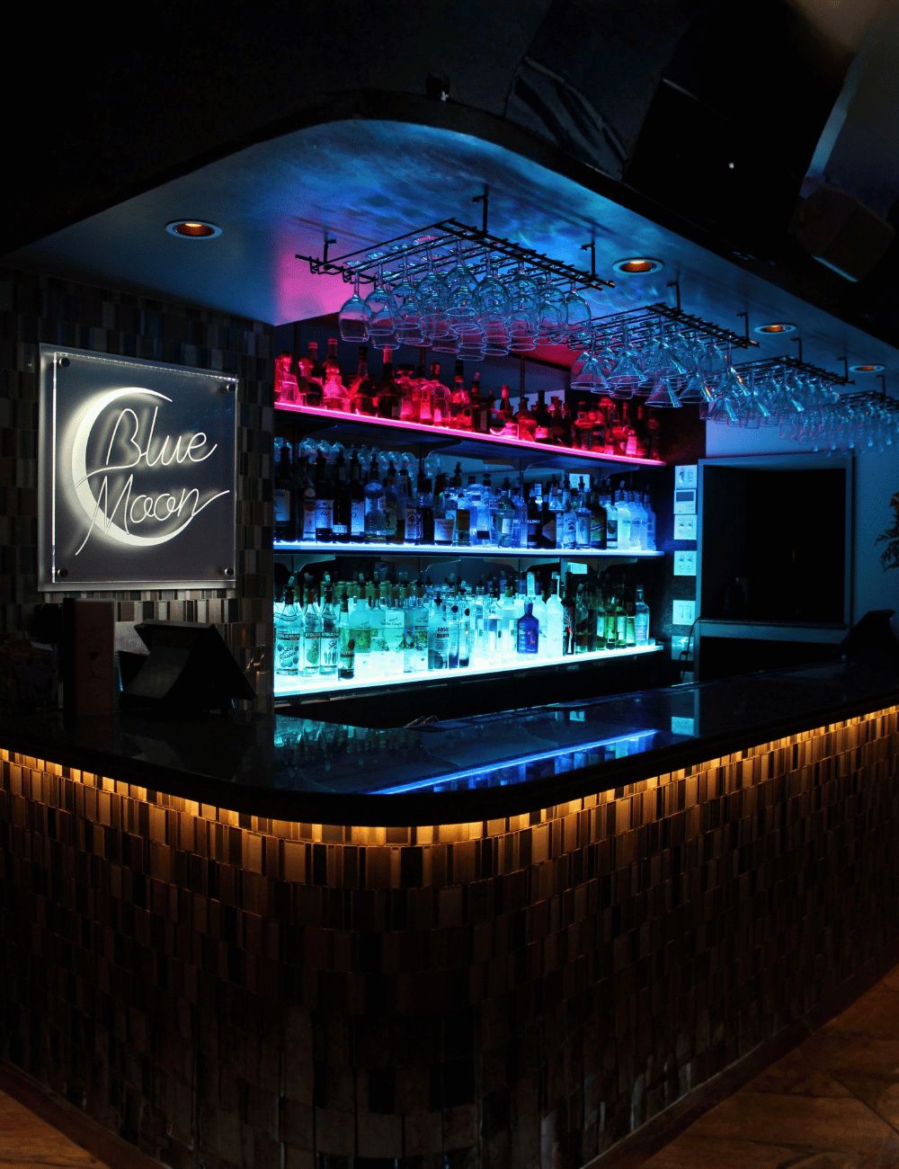 LED Bottle Shelves — vibrant, multi-coloured back-bar lighting