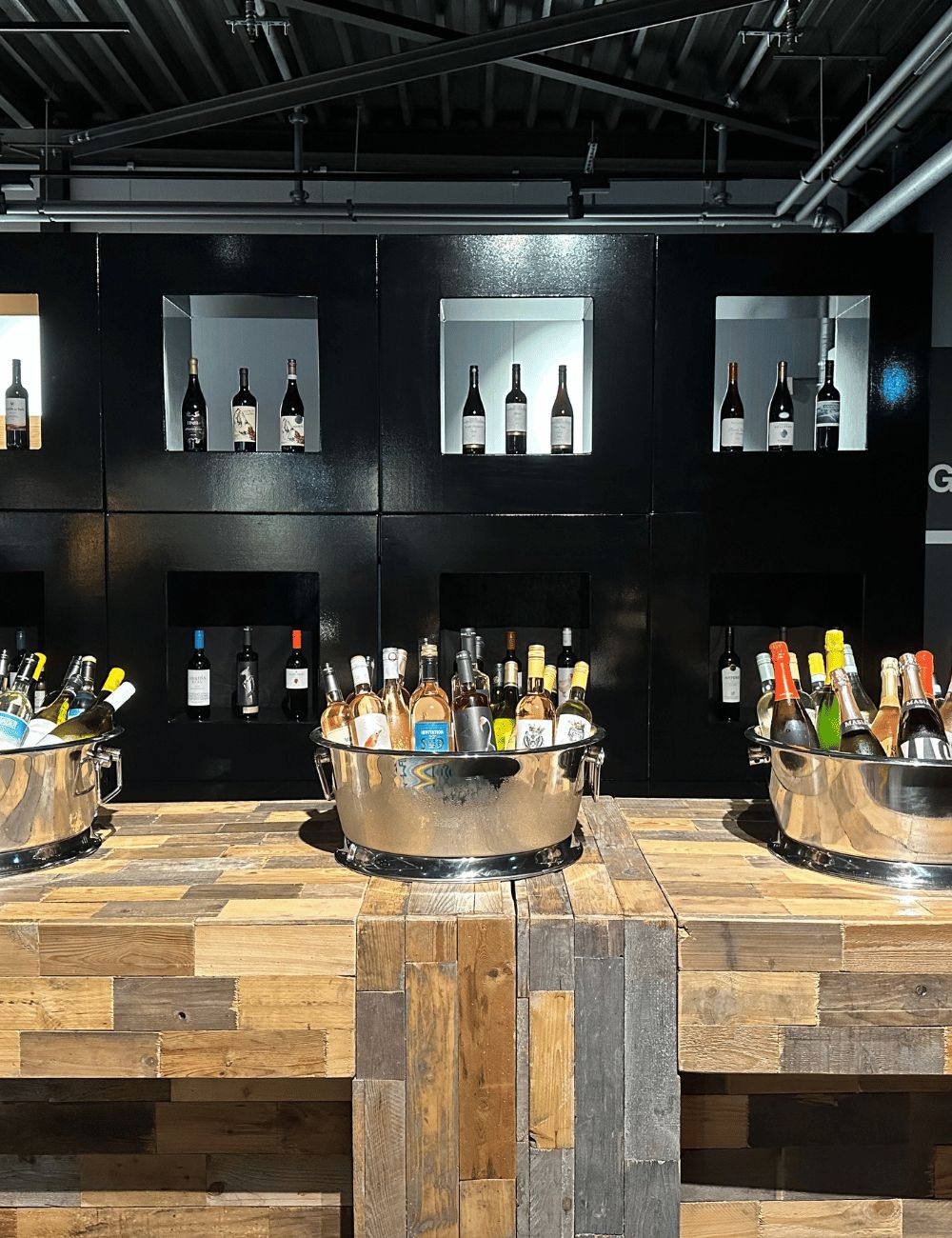 Portofino bowls filled with wines and sparkling wines, at a tasting on a wooden counter